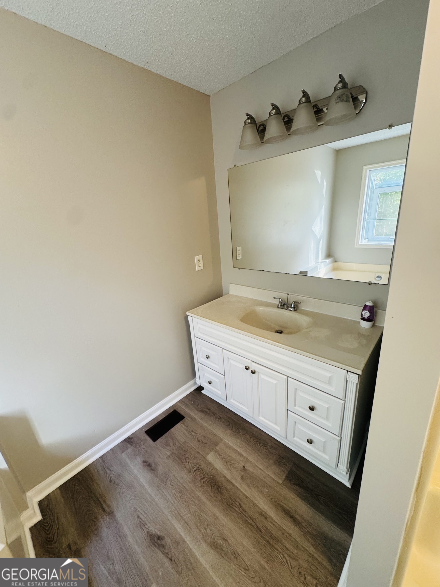 1516 Stark Road Jackson, GA 30233 - Photo 18 of 37 a bathroom with a sink and a mirror