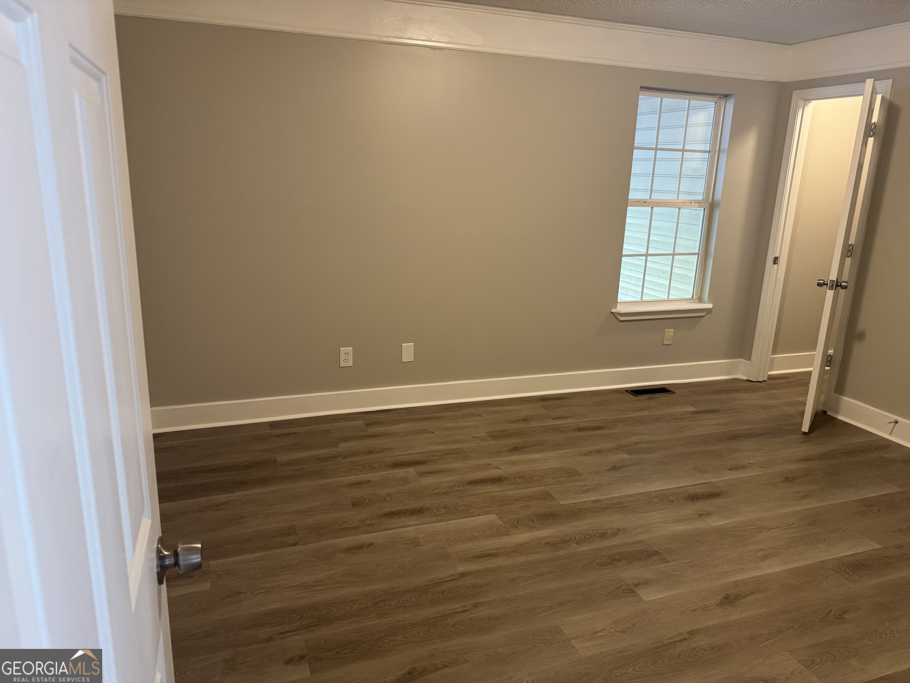 1516 Stark Road Jackson, GA 30233 - Photo 19 of 37 an empty room with wooden floor and windows