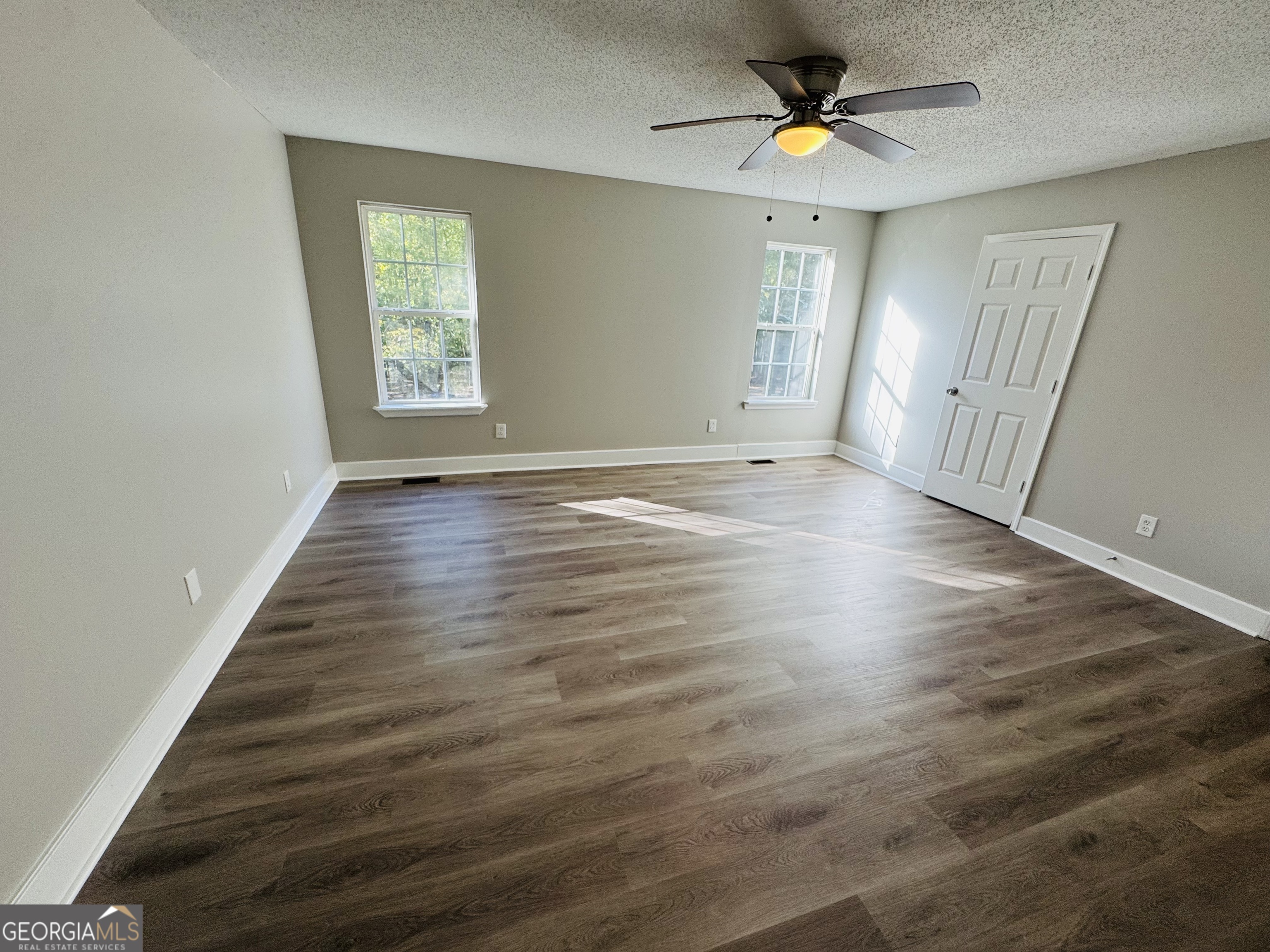 1516 Stark Road Jackson, GA 30233 - Photo 22 of 37 wooden floor in an empty room with a window