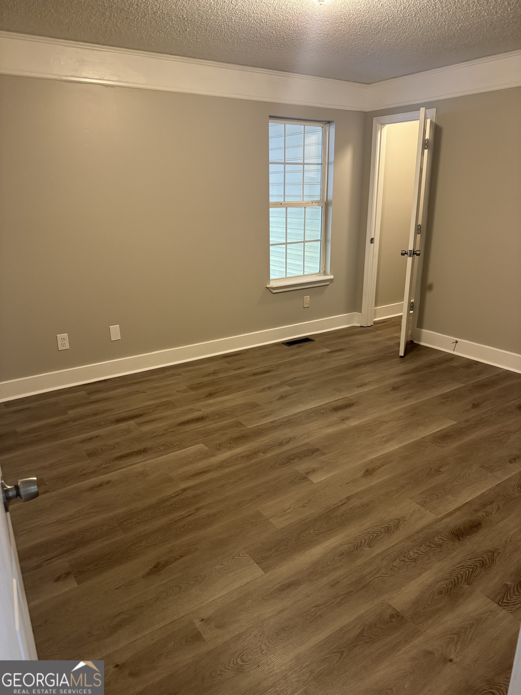 1516 Stark Road Jackson, GA 30233 - Photo 23 of 37 wooden floor in an empty room with a window
