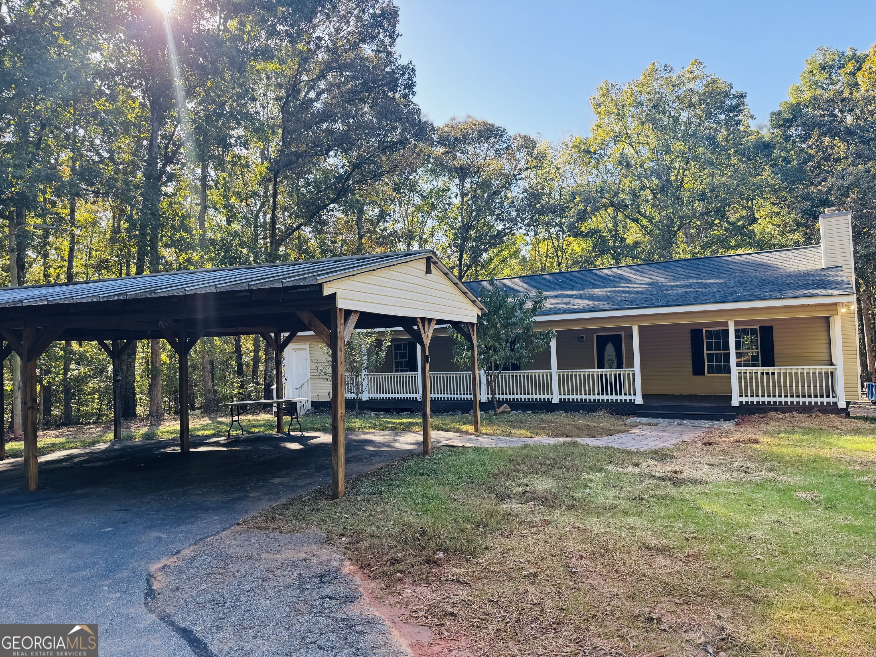 1516 Stark Road Jackson, GA 30233 - Photo 30 of 37 a backyard of a house with barbeque oven table and chairs