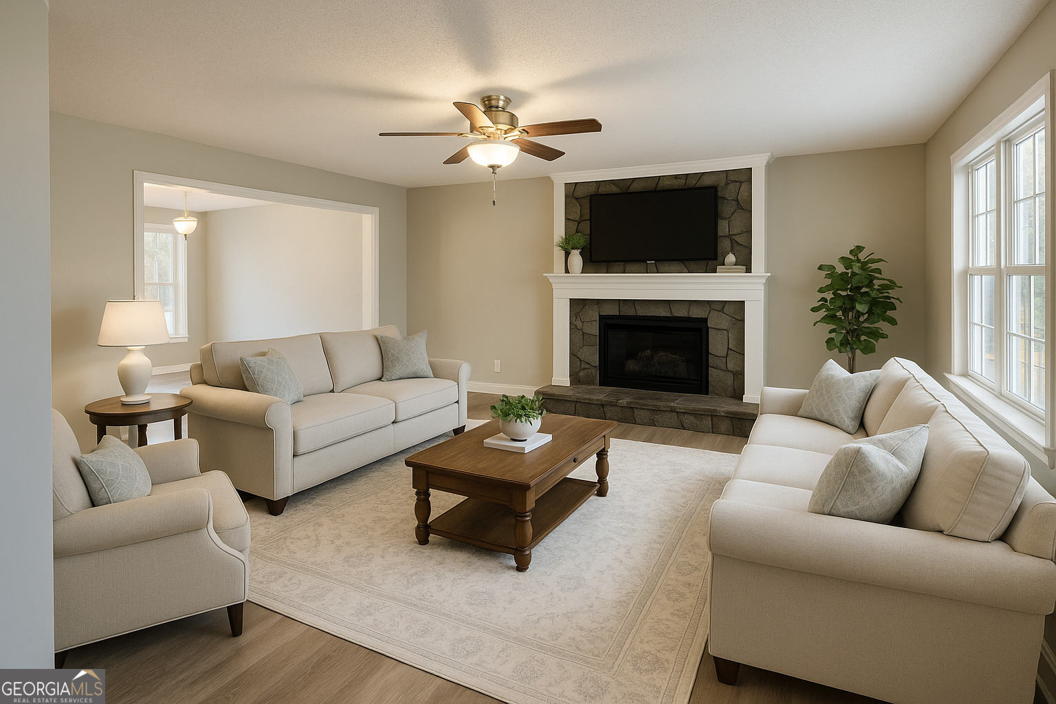 1516 Stark Road Jackson, GA 30233 - Photo 10 of 37 a living room with furniture a chandelier and a fireplace