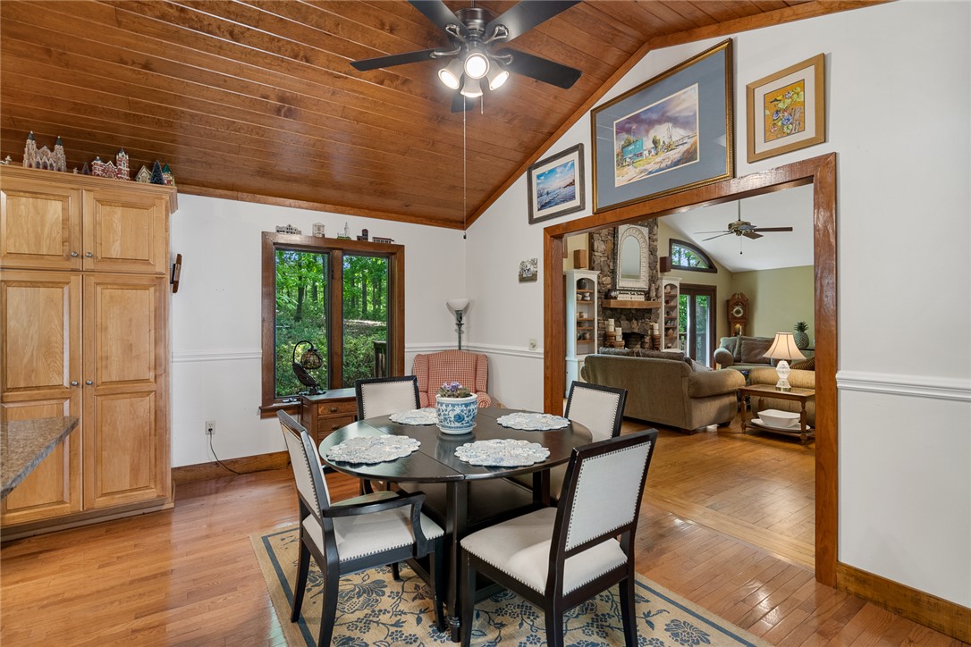 324 Hobson Road Anderson, SC 29621 - Photo 21 of 46 This inviting dining area features warm wooden accents, a vaulted ceiling, and an open layout.