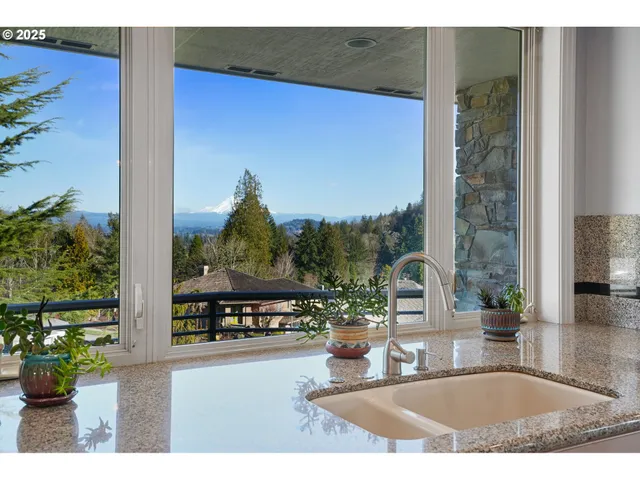 a view of a living room and a floor to ceiling window