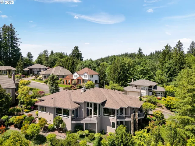 a view of a house with pool and chairs