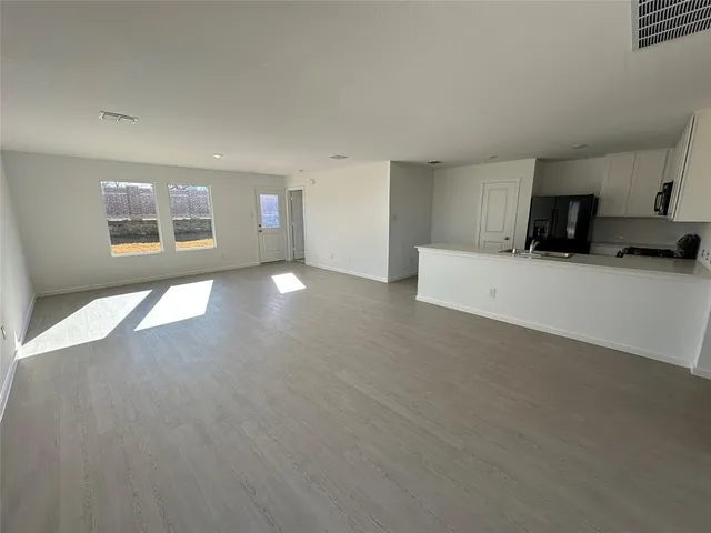 a view of a livingroom with furniture and a window