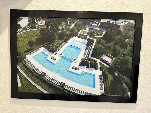 a view of house with yard in front of it