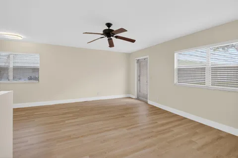 a view of room window and wooden floor