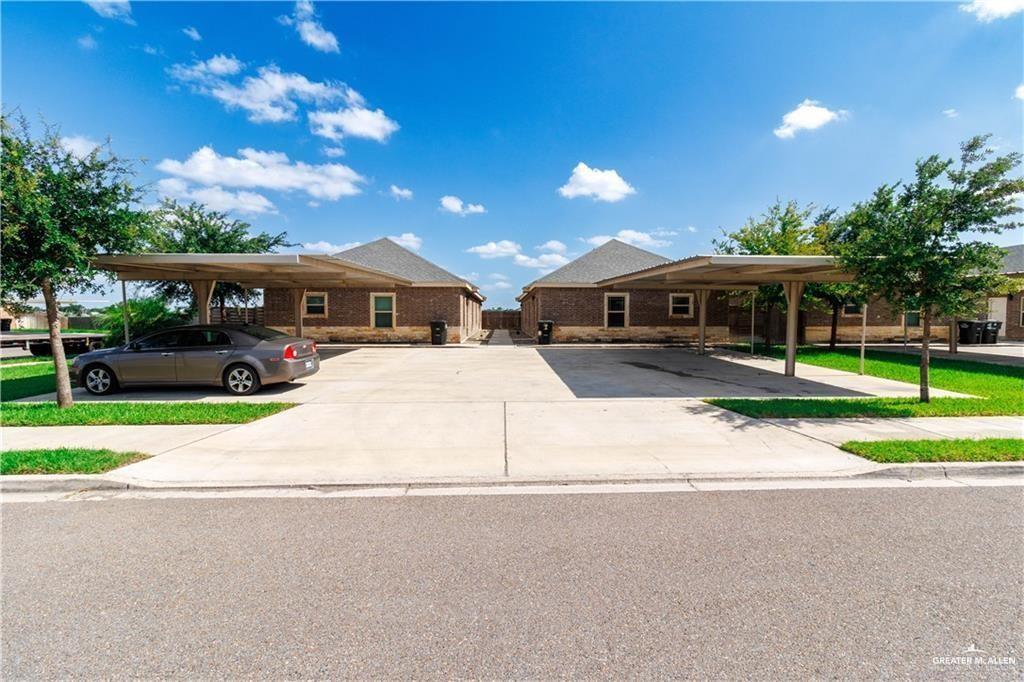 2804 East Garfield Avenue, Unit 4 Mission, TX 78573 - Photo 1 of 1 View of front of property featuring covered and uncovered parking and brick siding