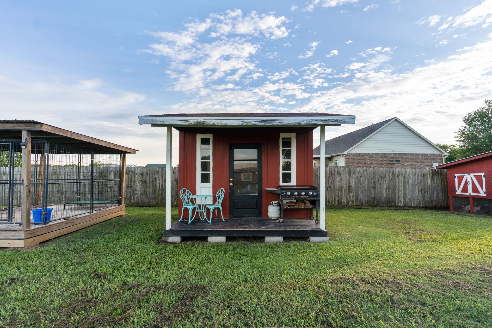 5942 Wildflower Road Sealy, TX 77474 - Photo 30 of 41 a view of a house with backyard porch and wooden floor