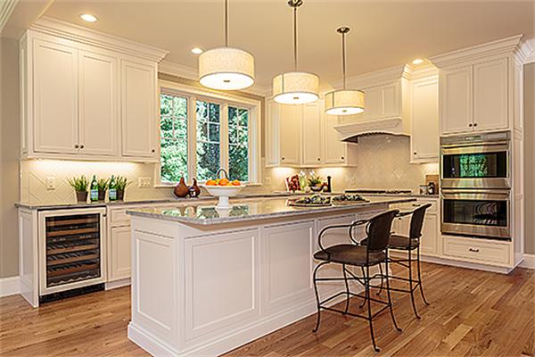 146 East Street Lexington, MA 02420 - Photo 2 of 9 a kitchen with stainless steel appliances granite countertop a stove a sink and white cabinets with wooden floors