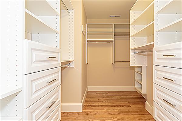 146 East Street Lexington, MA 02420 - Photo 8 of 9 a view of walk in closet with empty racks