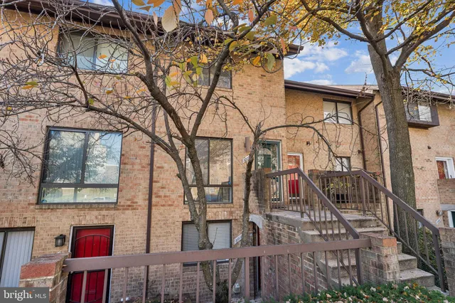 a view of a house with a tree