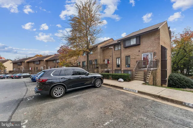 a view of a car parked in front of a house