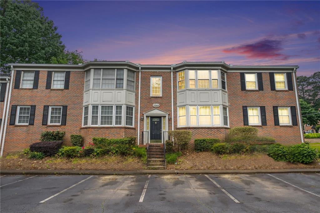 2349 Henderson Mill Road, Unit 2 Atlanta, GA 30345 - Photo 1 of 1 a front view of a house with a yard