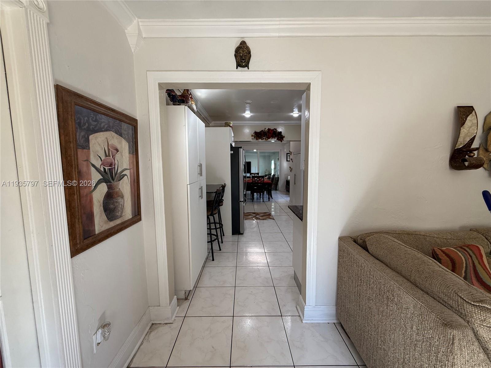 79 Northwest 143rd Street Miami, FL 33168 - Photo 14 of 37 a living room with furniture and a ceiling fan