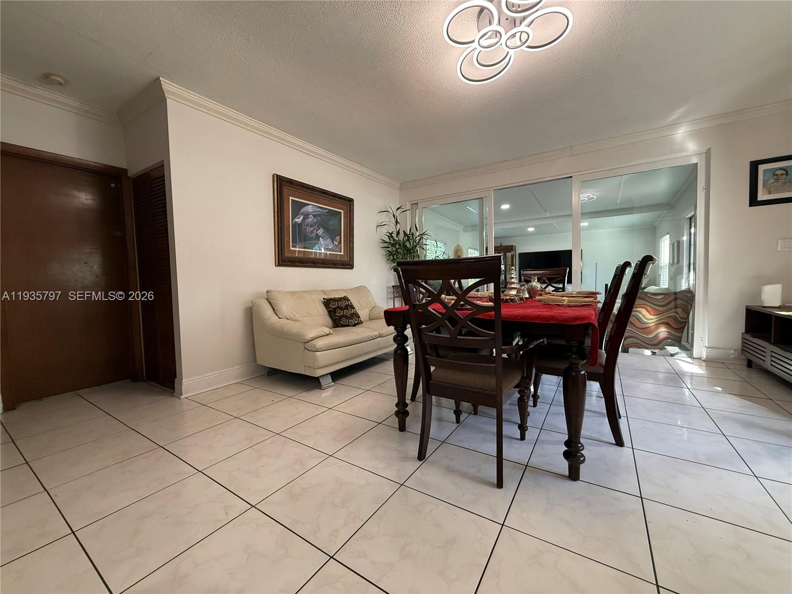 79 Northwest 143rd Street Miami, FL 33168 - Photo 21 of 37 a view of a livingroom with furniture and window