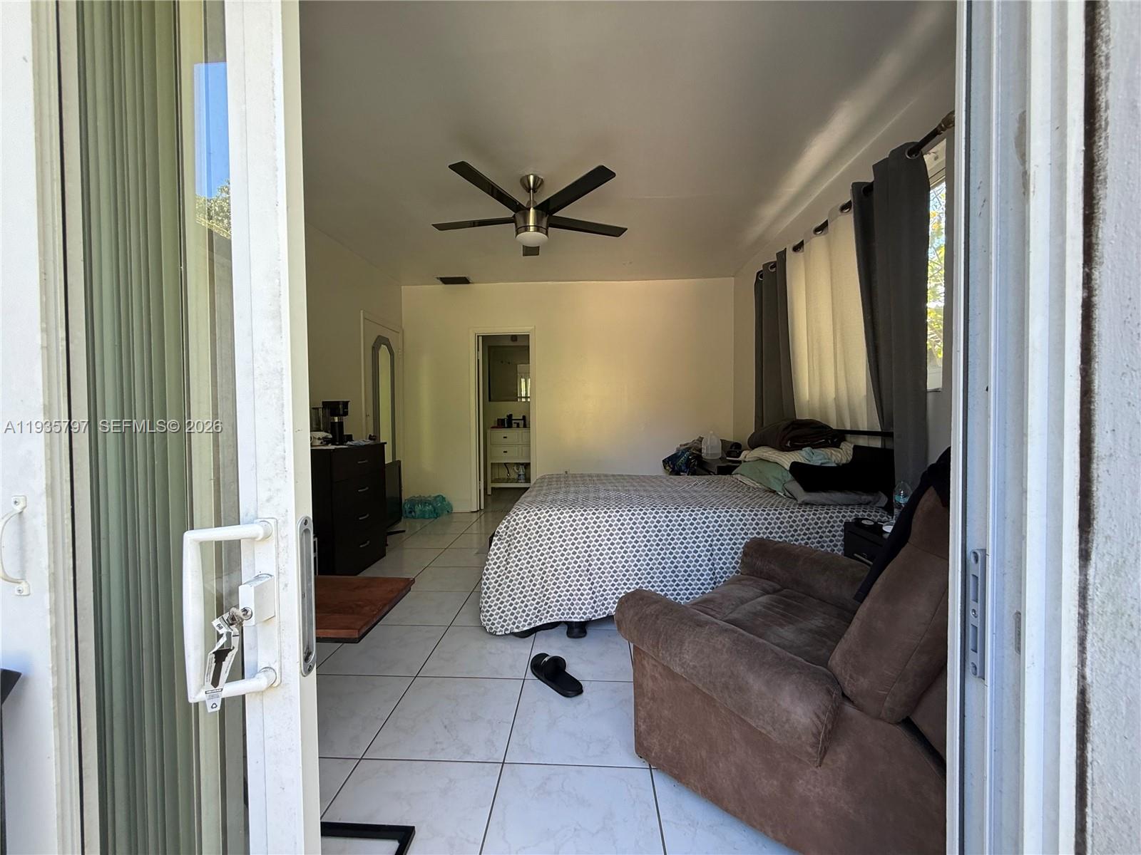 79 Northwest 143rd Street Miami, FL 33168 - Photo 25 of 37 a living room with furniture and a rug