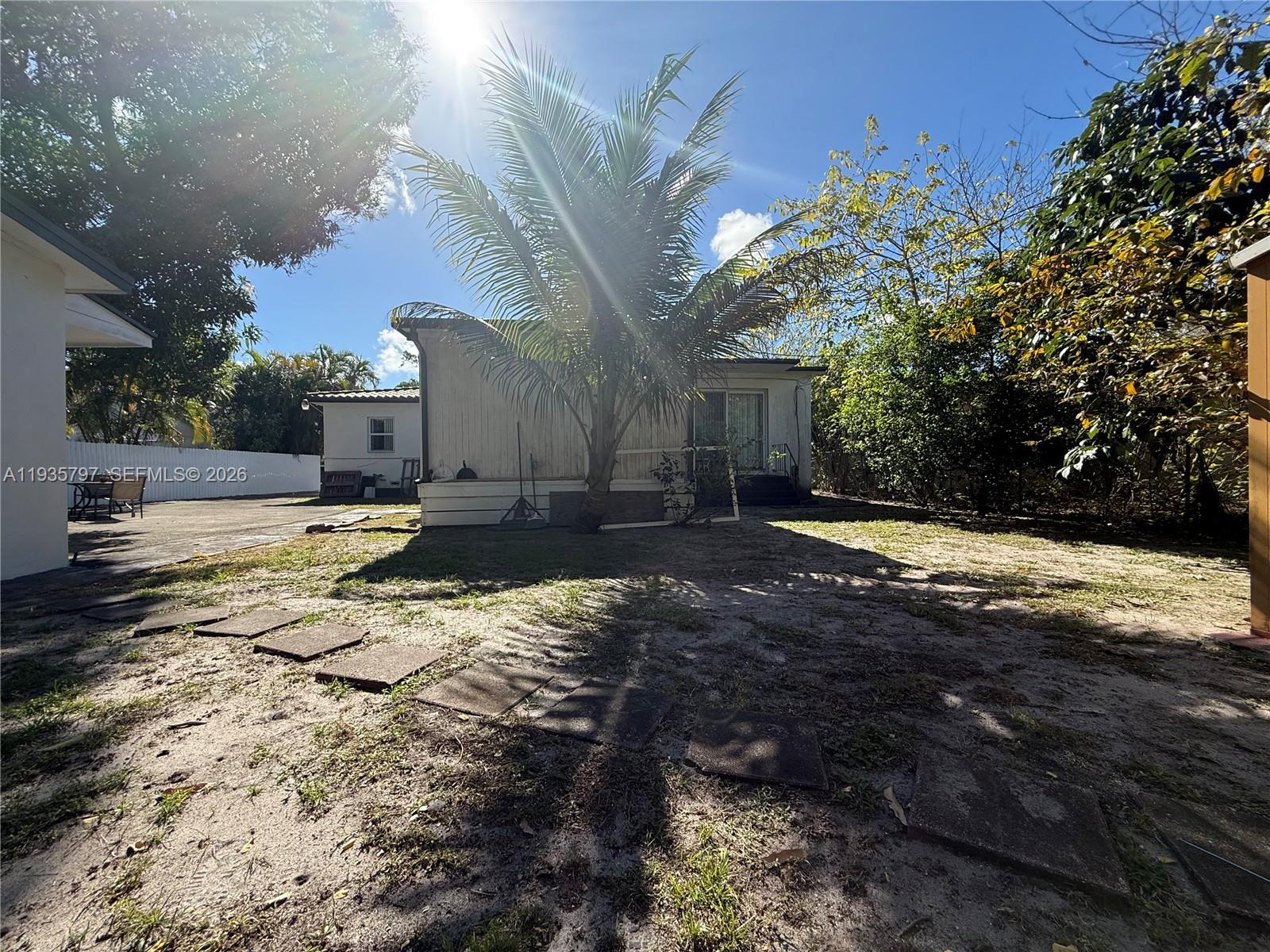 79 Northwest 143rd Street Miami, FL 33168 - Photo 37 of 37 a view of a yard with an outdoor space