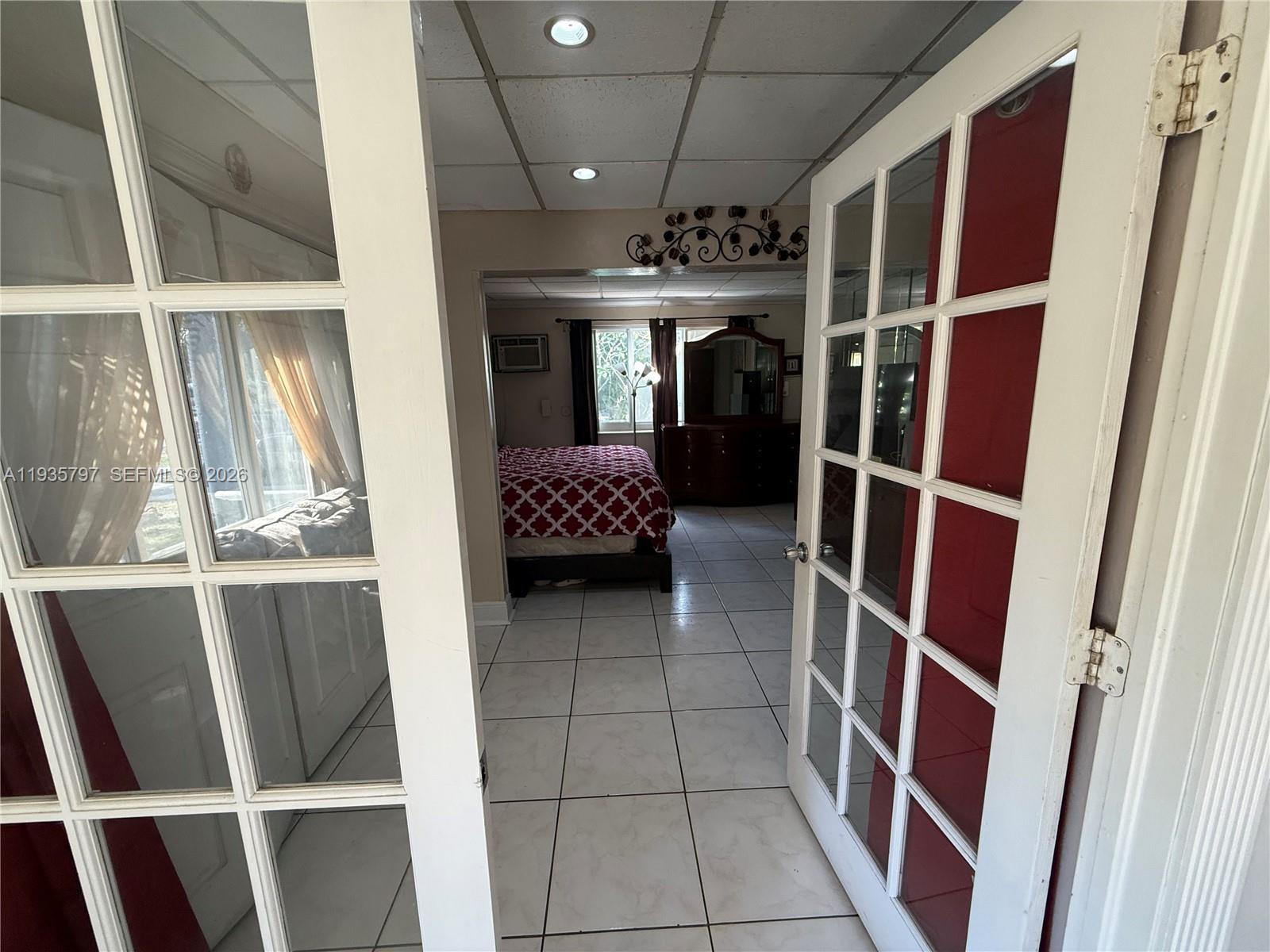 79 Northwest 143rd Street Miami, FL 33168 - Photo 5 of 37 a view of an empty room with a window