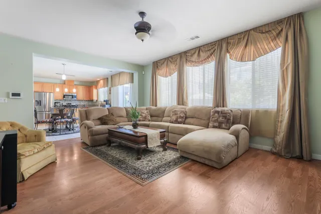a living room with furniture and a large window