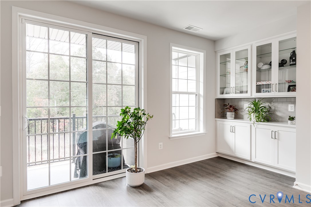 13267 Garland Lane Midlothian, VA 23114 - Photo 14 of 35 a view of an empty room with a window and wooden floor