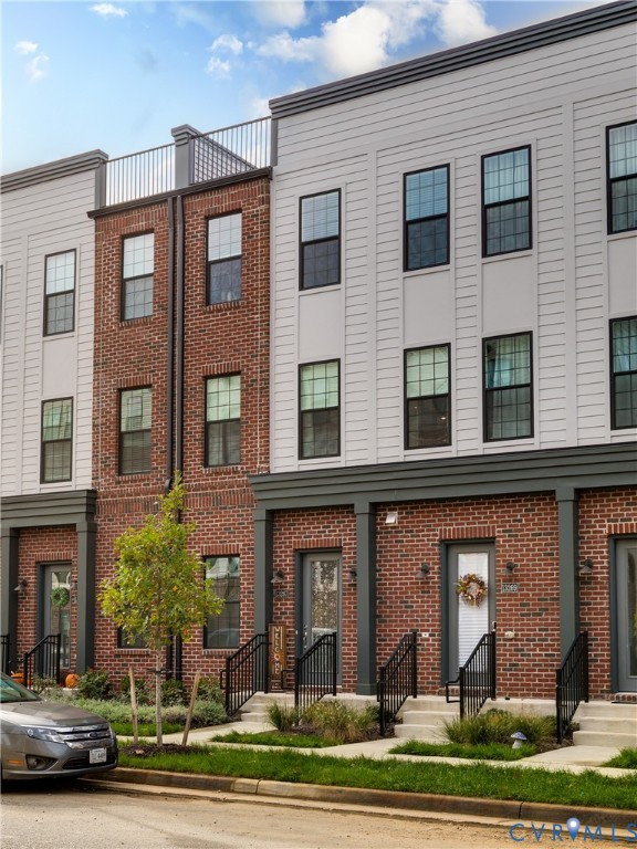 13267 Garland Lane Midlothian, VA 23114 - Photo 2 of 35 a front view of a residential apartment building with a yard