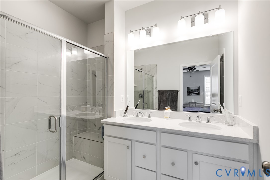 13267 Garland Lane Midlothian, VA 23114 - Photo 22 of 35 a bathroom with a double vanity sink mirror and shower