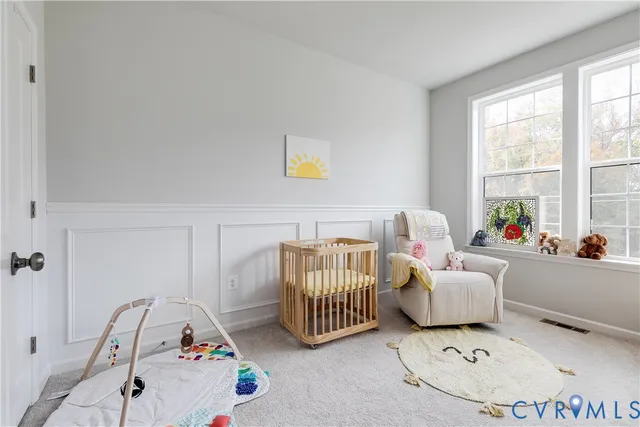 a bedroom with furniture and a window