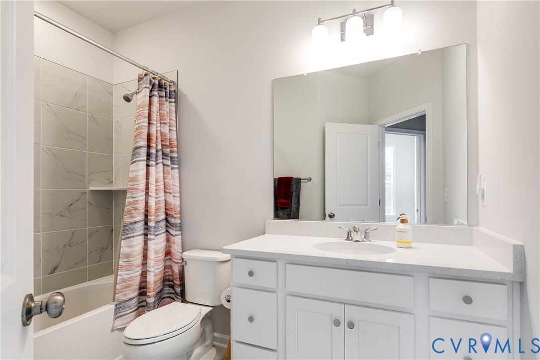 13267 Garland Lane Midlothian, VA 23114 - Photo 26 of 35 a bathroom with a sink vanity mirror and toilet