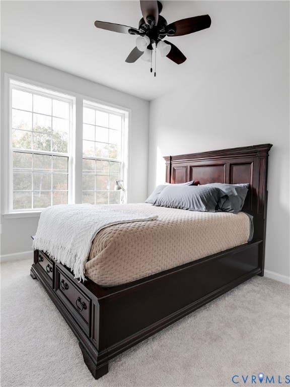 13267 Garland Lane Midlothian, VA 23114 - Photo 27 of 35 a large bed sitting in a bedroom next to a window