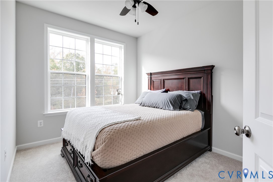13267 Garland Lane Midlothian, VA 23114 - Photo 28 of 35 a bed sitting in a bedroom next to a window