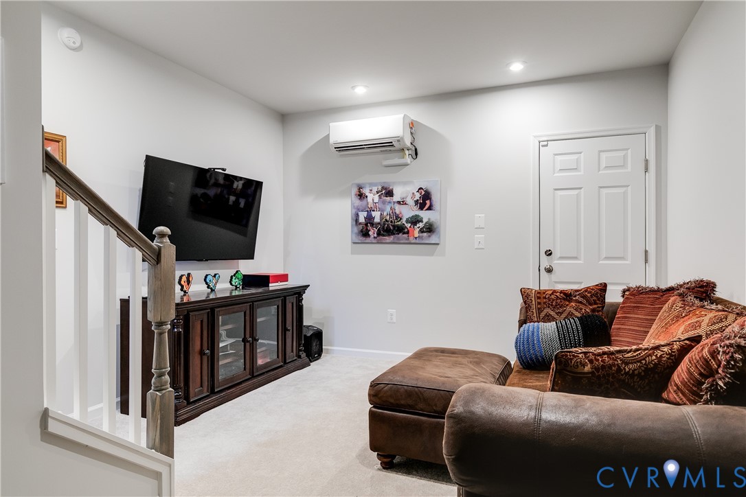 13267 Garland Lane Midlothian, VA 23114 - Photo 30 of 35 a living room with furniture and a flat screen tv