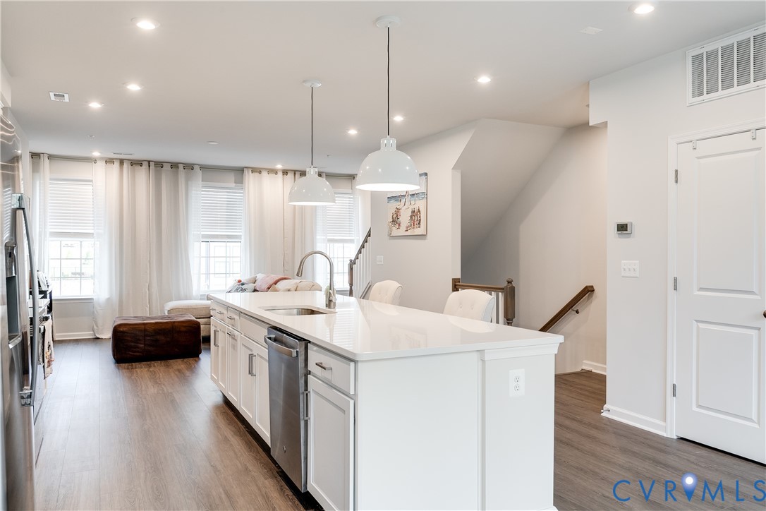 13267 Garland Lane Midlothian, VA 23114 - Photo 3 of 35 a kitchen with a sink a stove and a wooden floor