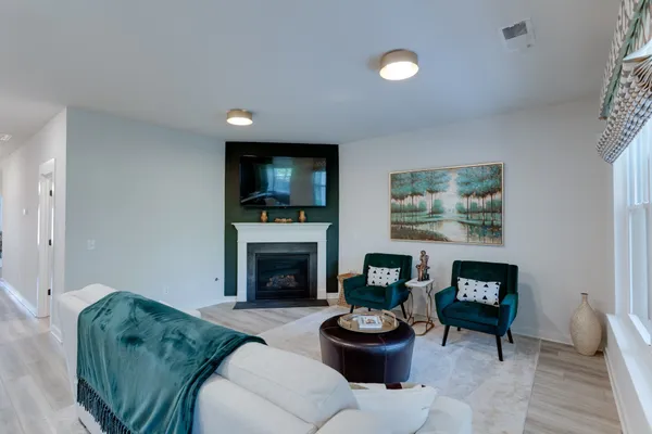 a living room with furniture and a large window
