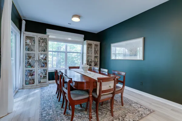 a view of a dining room with furniture and window