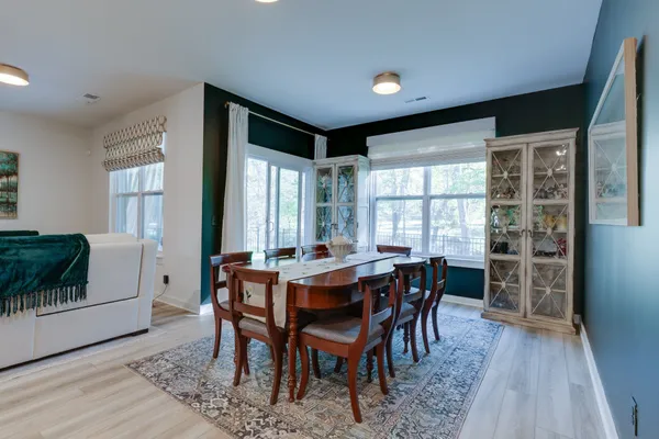 a view of a dining room with furniture