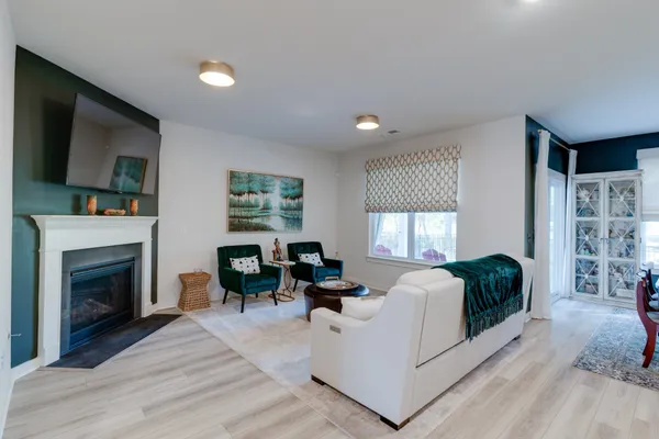 a dining room with furniture and window
