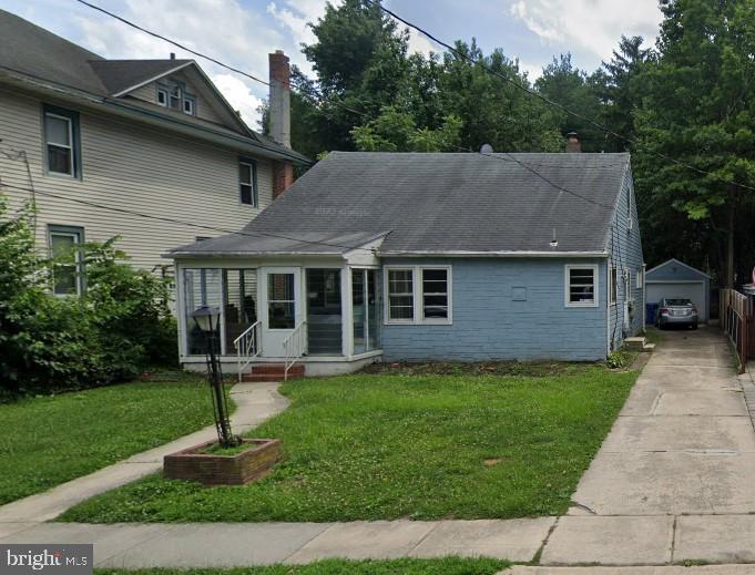a front view of a house with a yard table and chairs