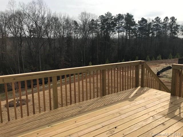 1573 Tranquility Boulevard, Unit 427 Lancaster, SC 29720 - Photo 6 of 12 a balcony with wooden floor