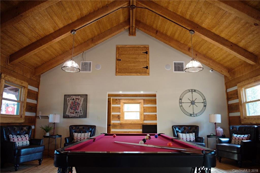 1573 Tranquility Boulevard, Unit 427 Lancaster, SC 29720 - Photo 9 of 12 a bed room with a bed a mirror and a window