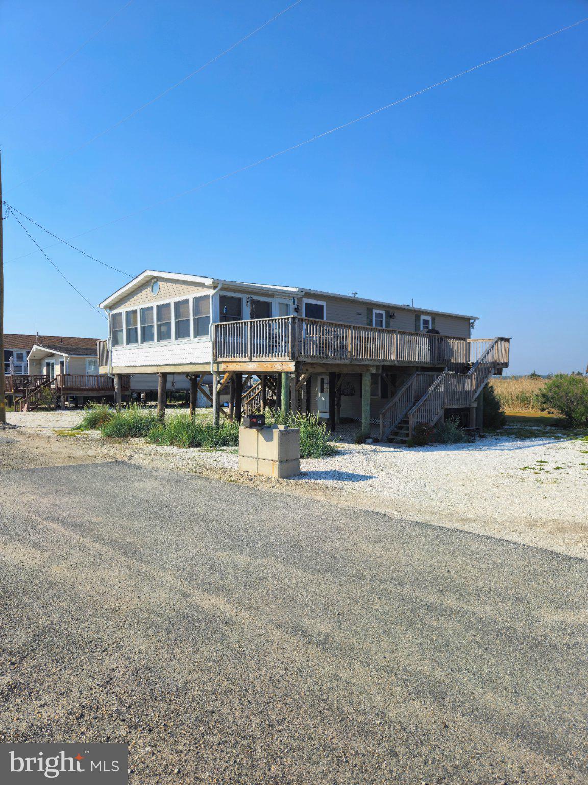 167 Cove Road Newport, NJ 08345 - Photo 3 of 38 a front view of a house with a yard