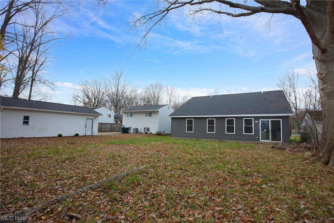5461 Lear Nagle Road North Ridgeville, OH 44039 - Photo 14 of 26 Rear view of house with a lawn