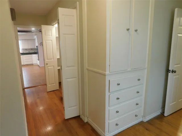 a large kitchen with stainless steel appliances granite countertop a stove sink and cabinets