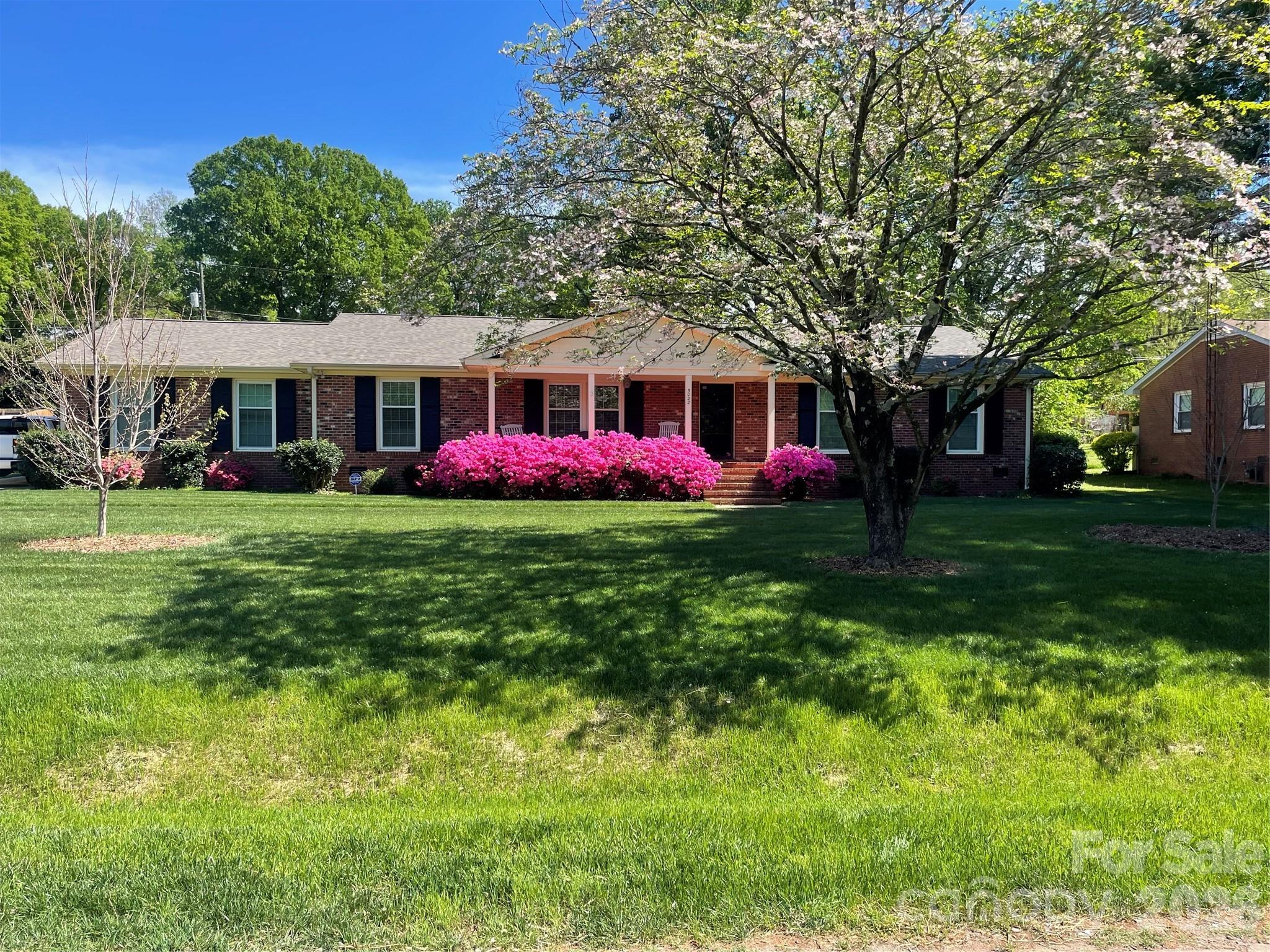 5022 Cheviot Road Charlotte, NC 28269 - Photo 3 of 4 a front view of house with yard and green space