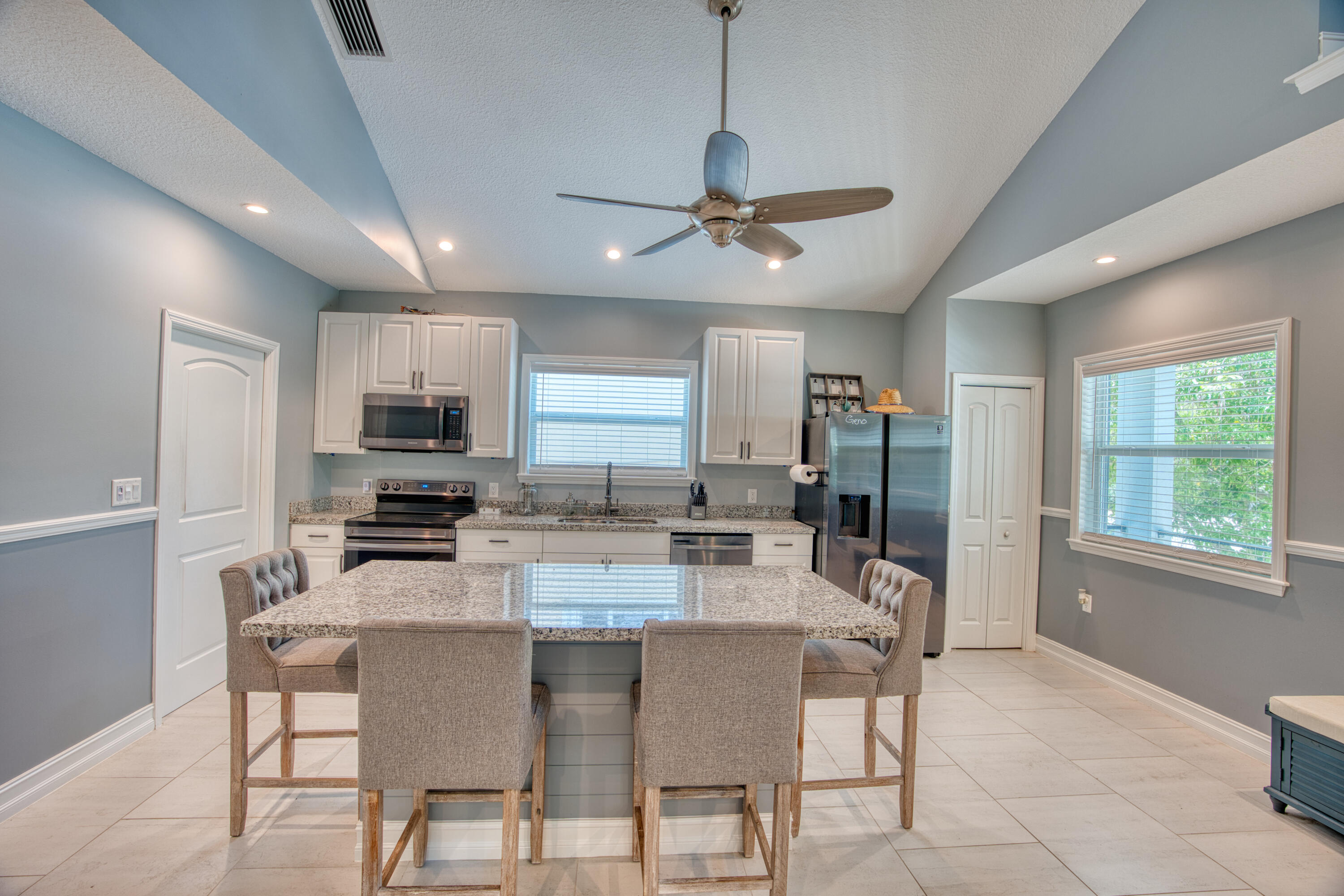 499 Beach Road Tavernier, FL 33070 - Photo 12 of 53 a view of a dining room with furniture window and wooden floor