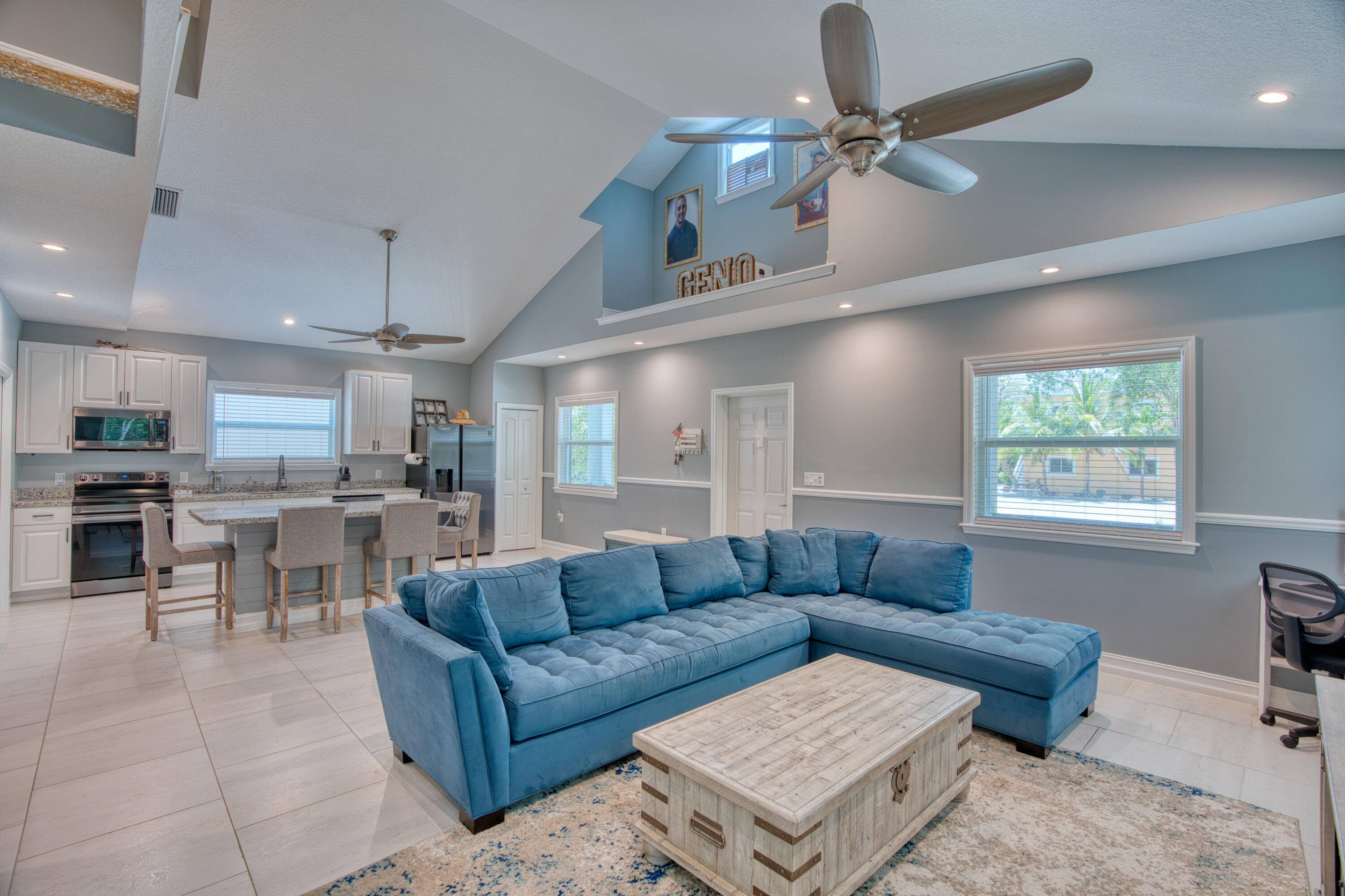 499 Beach Road Tavernier, FL 33070 - Photo 17 of 53 a living room with furniture and a view of kitchen