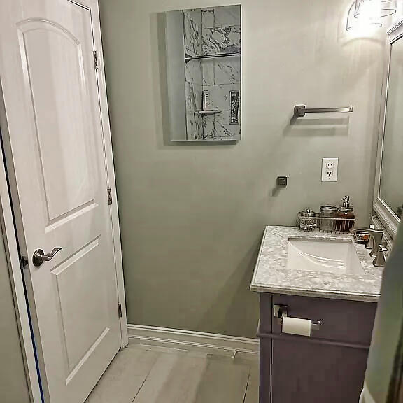 499 Beach Road Tavernier, FL 33070 - Photo 28 of 53 a bathroom with a sink and a mirror