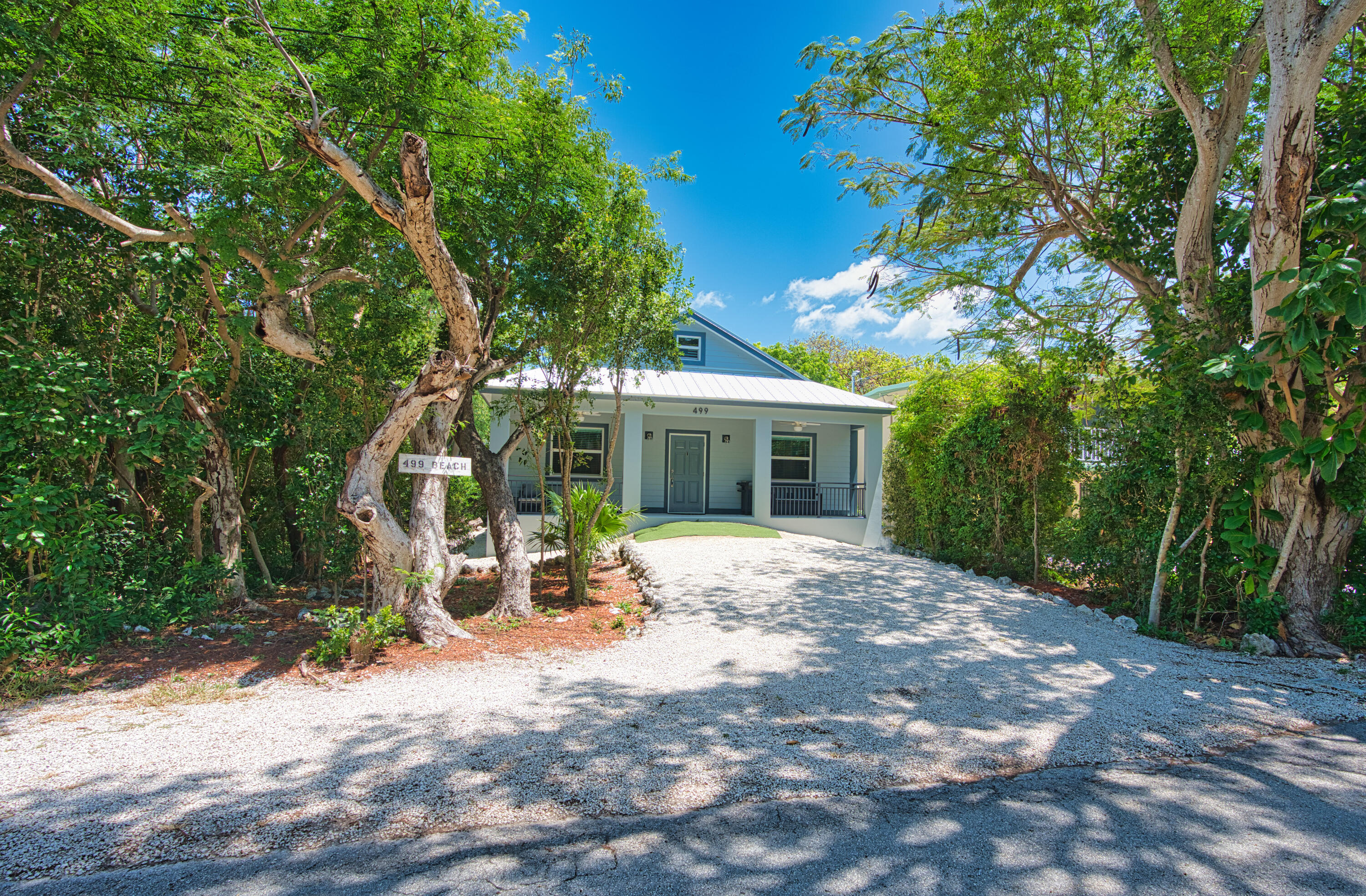 499 Beach Road Tavernier, FL 33070 - Photo 35 of 53 a view of a house with backyard and sitting area