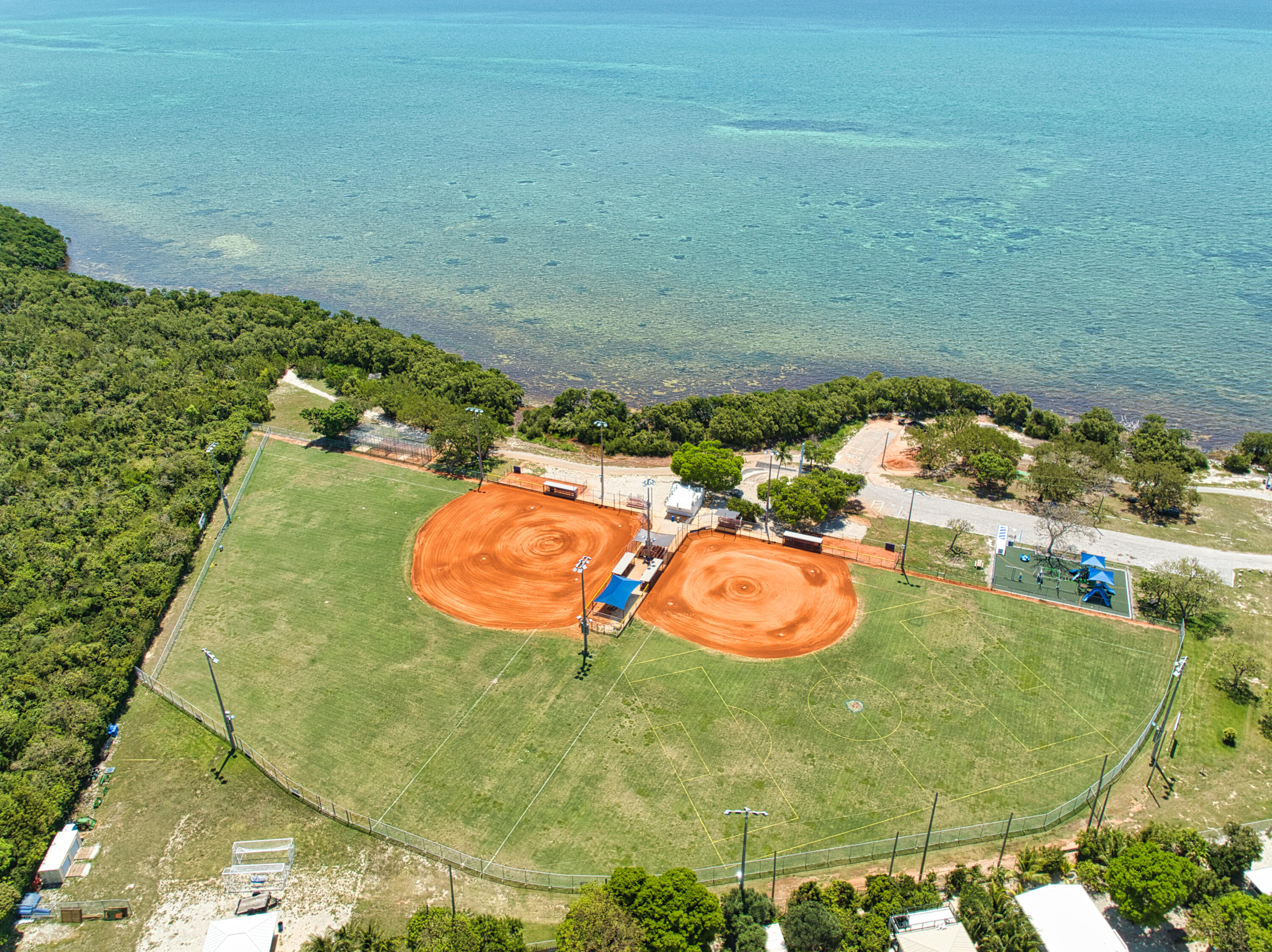 499 Beach Road Tavernier, FL 33070 - Photo 48 of 53 a bathroom with a sink and mirror